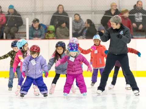 a group of kids ice skating