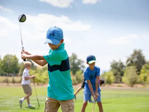 a group of people playing golf