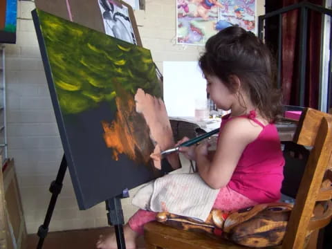 a young girl painting