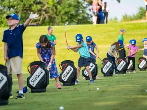 a group of people playing golf