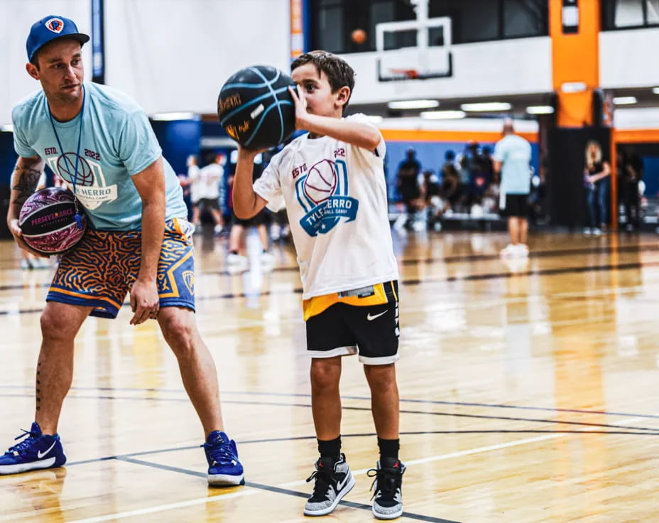 a couple of men playing basketball
