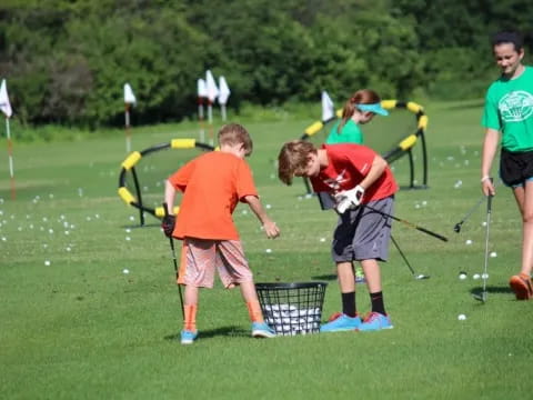 a group of kids playing golf