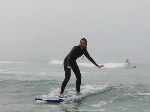 a man riding a surfboard