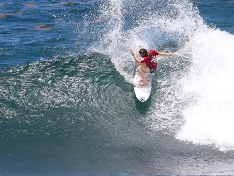 a person surfing on the waves