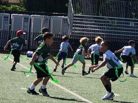 a group of kids playing football