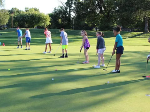 a group of people playing golf