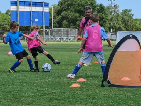 kids playing football on a field