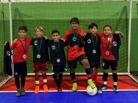 a group of football players posing for a photo