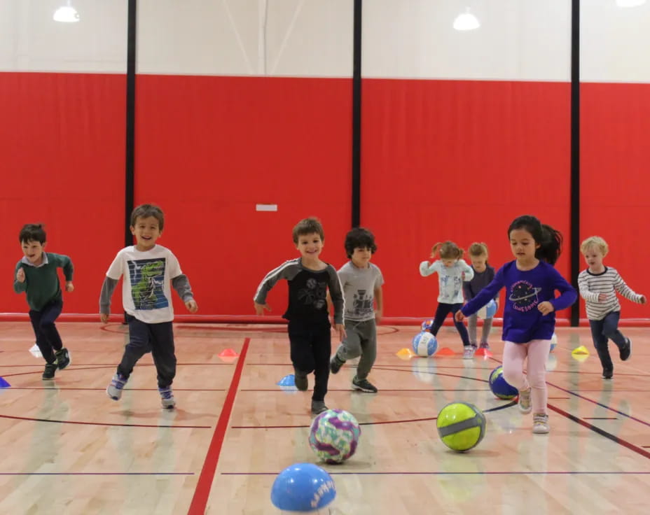 kids playing with football balls