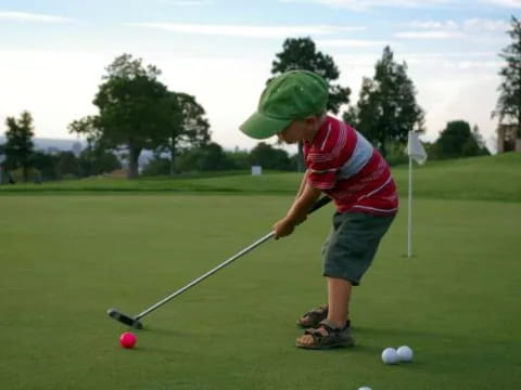 a boy playing golf