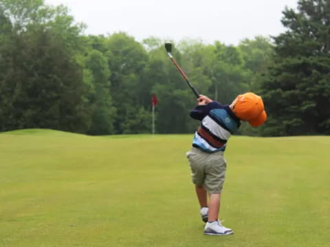 a man swinging a golf club