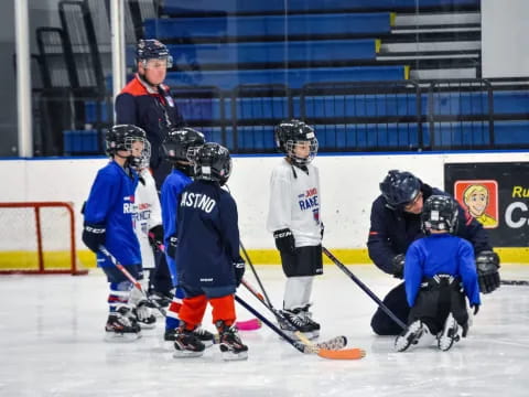 a group of people playing hockey