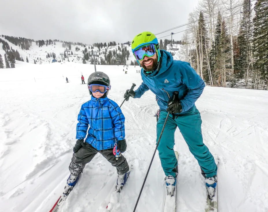 a person and a child skiing