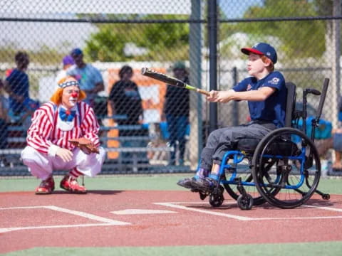 a kid in a wheelchair playing baseball