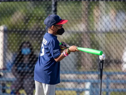 a young boy playing baseball