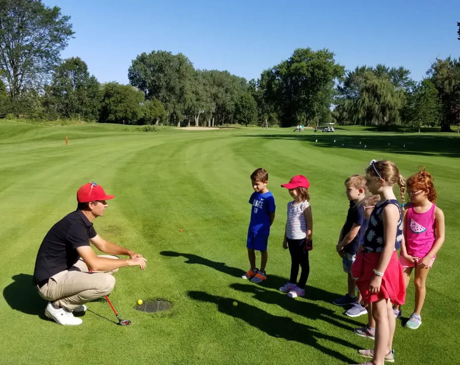 a group of people standing on grass