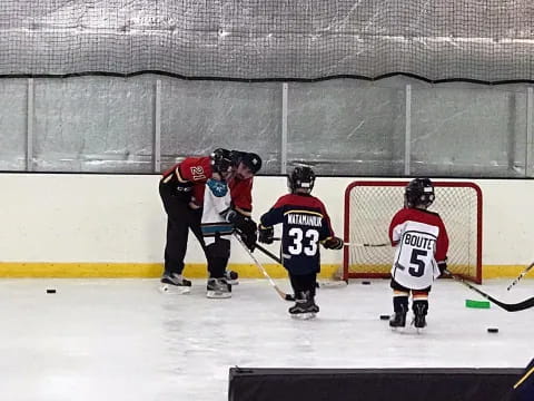 a group of people playing hockey