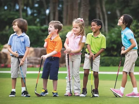 a group of kids holding sticks