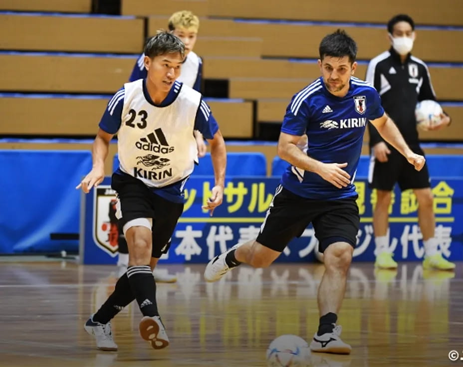 a group of men playing football