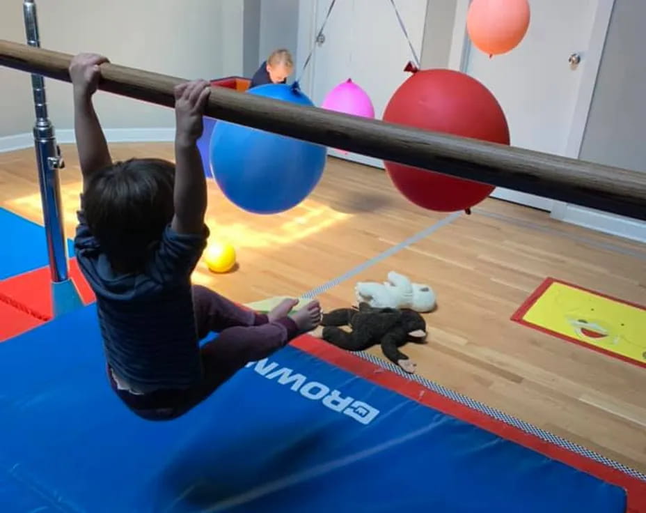 a few people exercising in a gym