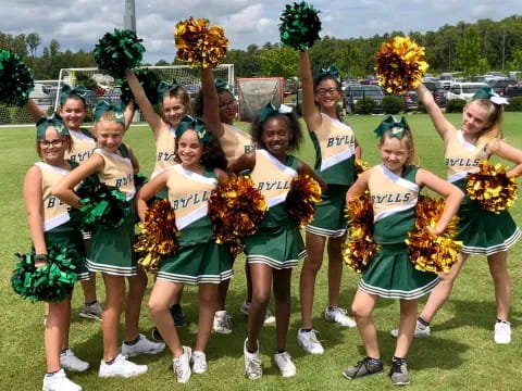 a group of cheerleaders posing for a photo