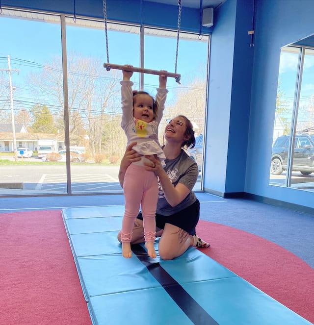 a woman holding a baby