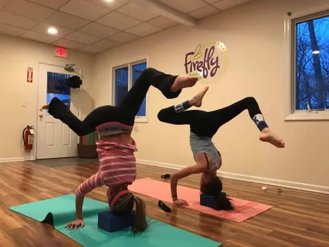 a couple of people doing yoga