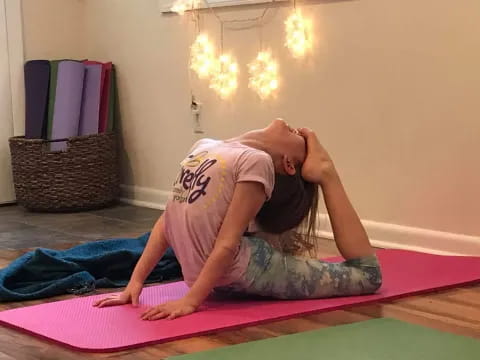 a person lying on a mat