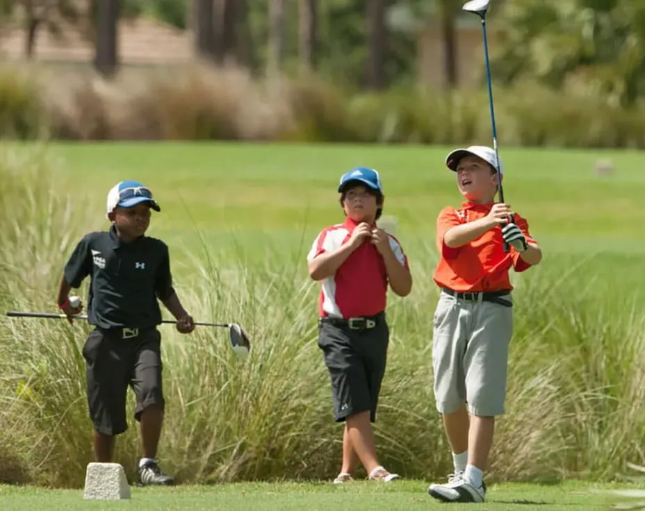 a group of people playing golf