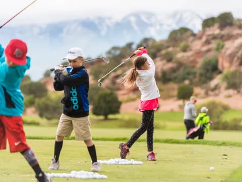 a group of people playing golf