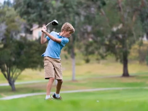 a man swinging a golf club