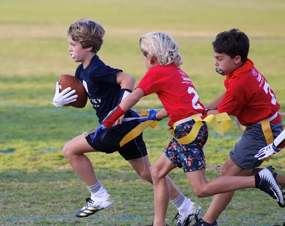 a group of boys playing rugby