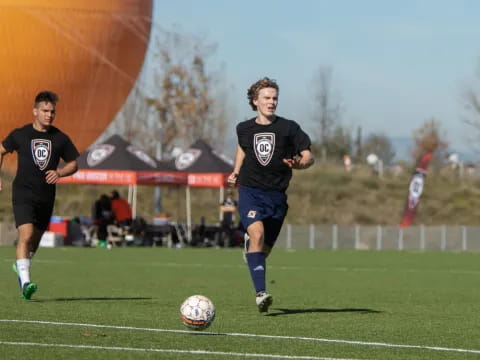 a couple of men playing football
