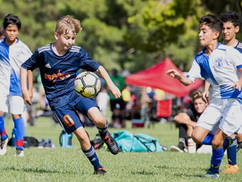 a group of boys playing football