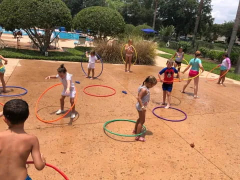 a group of children playing in a playground