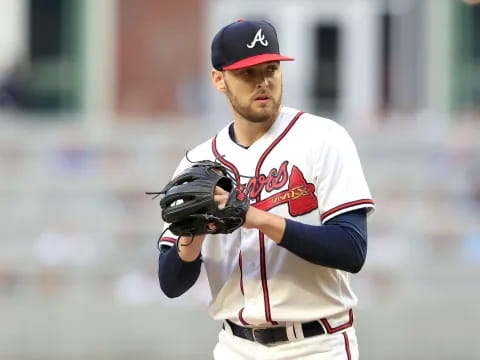 a baseball player in a red hat