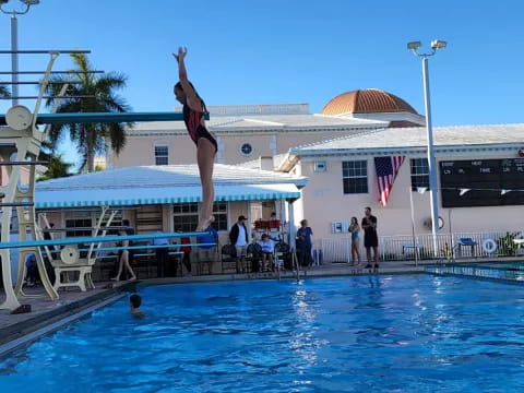 a person jumping into a pool