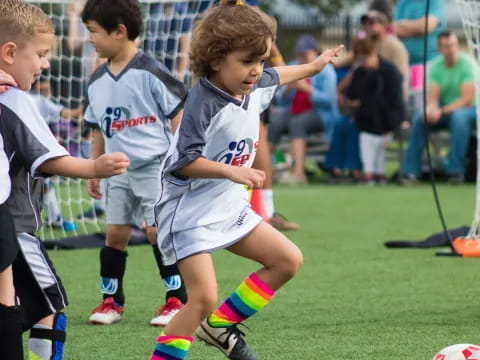 kids playing football on a field