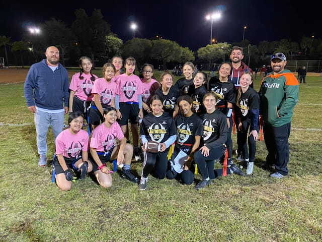 a group of people posing for a photo