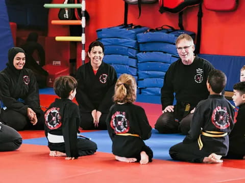 a group of people sitting on the floor