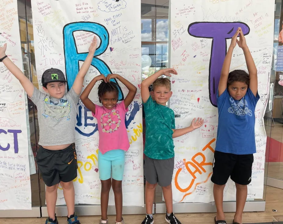 a group of kids posing for a picture