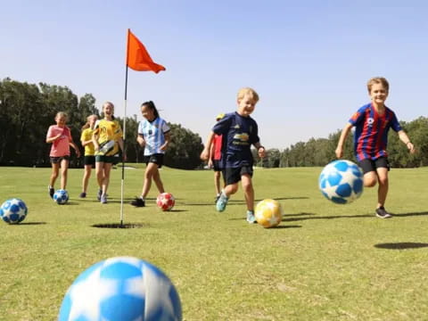 kids playing football on a field