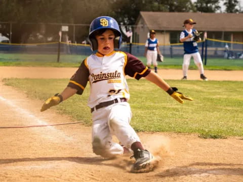 a young boy playing baseball