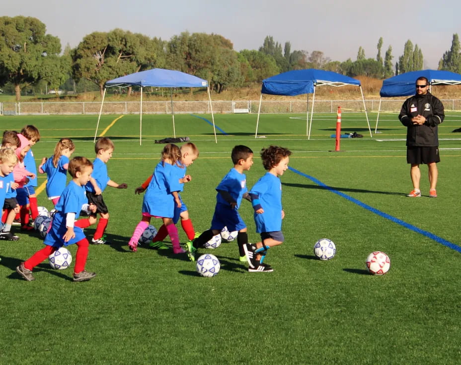 a group of kids playing football