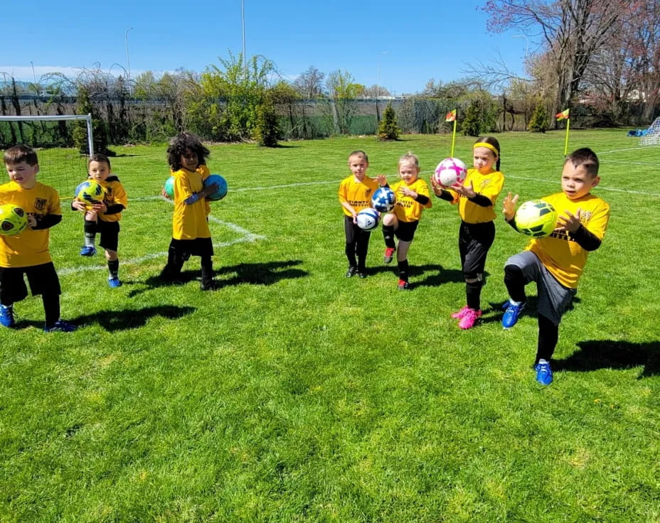 a group of kids playing football