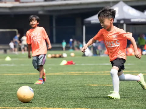 kids playing football on a field