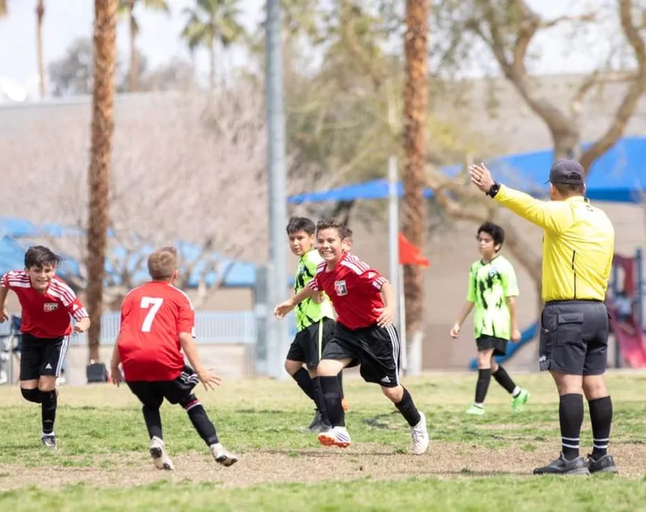 a group of people playing football