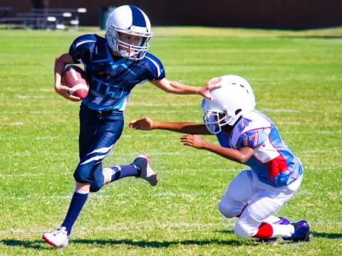 a group of people playing football