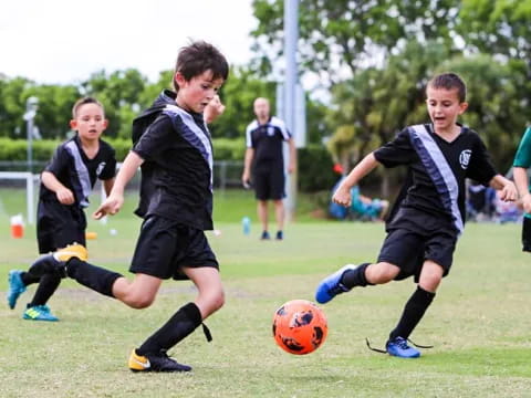 a group of boys playing football