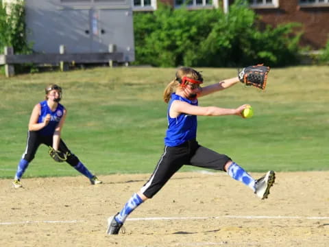 a person catching a baseball